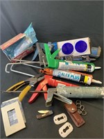 Caulking guns, pair of clippers, old timer knife,