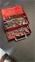 Red metal box and wrenches and sockets 1/4