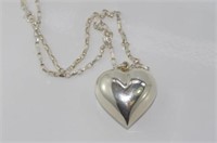 Silver heart shaped pendant on silver chain