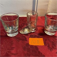 Three vintage shot glasses, one boot form