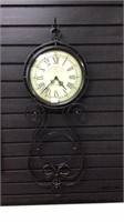 Wall decor Hanging clock with metal frame.