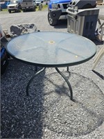 Round glass top patio table