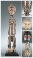 4 West African masks and figures. 20th century.