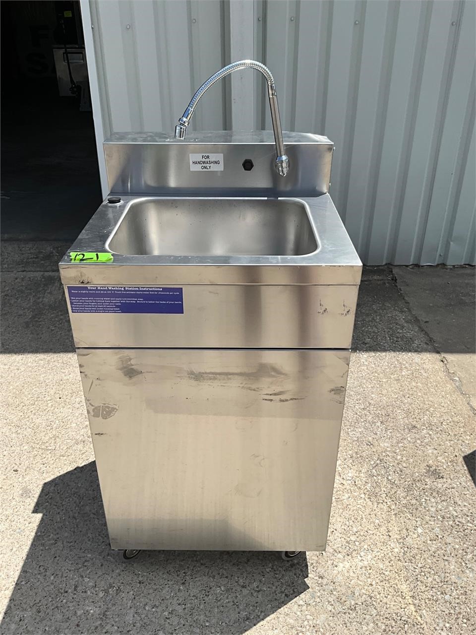 Portable sink with hot water heater
