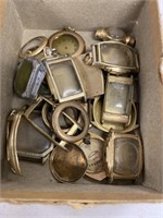 Box of gold colored and gold filled watch bodies