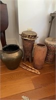 Two African wood drums, carved wood jug, and a