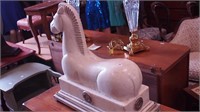 Decorative plaster horse on metal stand,