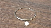 Adjustable bangle with a faceted White stone 2.5