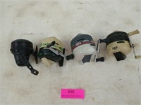 Four assorted fishing reels