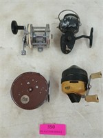 Four assorted fishing reels
