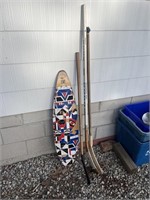 Skateboard and Hockey Sticks
