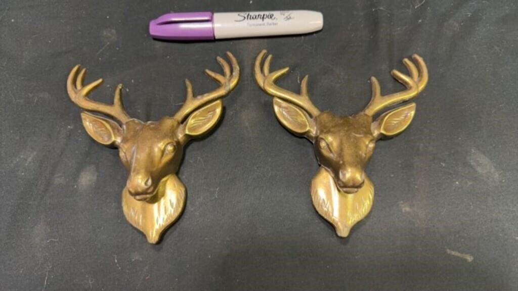 Brass deer heads