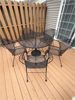 Iron patio table and 5 chairs