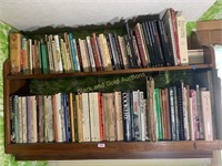 Two shelves of assorted cookbooks