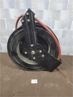 Air hose with wall mount wheel