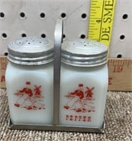 Set of milk glass salt &pepper shakers with rack