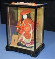 Aisian Doll In Glass Case