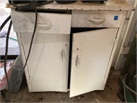 White metal cabinet with contents