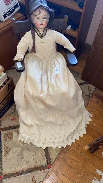 36 inch Baby Doll. Dressed Amish style. Chair not
