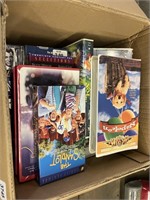 box of VHS tapes some disney, some new sealed