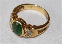 GREEN STONE RING MARKED 18K NOT SURE IF ITS