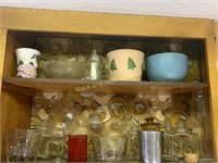 Two shelves of glassware and more