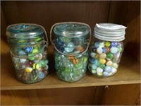 Three jars vintage marbles
