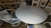 round white table with 4 matching chairs