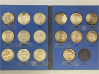 16 - silver Peace dollars in book
