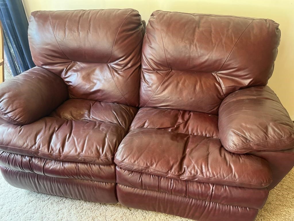 Maroon Pleather reclining love seat