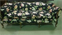 Wood trimmed Floral couch;