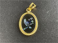 Small pendant with an opal mosaic scene depicting