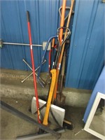 Assorted saws, shovels, brooms, and more
