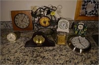 375: (8) assorted clocks