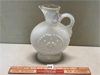 MILK GLASS TYPE EMBOSSED HANDLED JUG