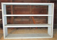 Wood shelf with blue paint. Measures 34" h x 45"