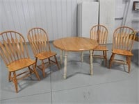 Drop leaf table w/4 chairs; one leg has some damag