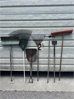 Metal snow shovel, rakes , and push broom