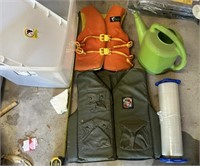 tote and 2 life jackets and water can