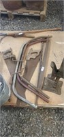 Lot of saws, hand drill, and jack