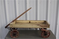 Yellow and red slated wagon with cast iron wheels