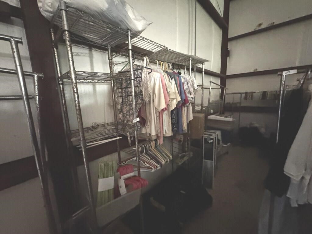 LOT OF CLOTHING AND HANGERS