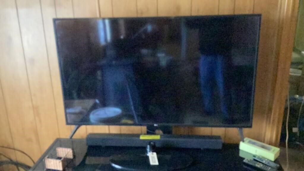 LG TV 55” on an entertaining center w stand,