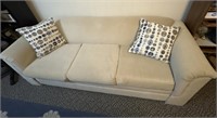 Couch with two throw pillows