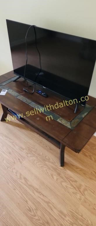 Table and Hisense TV approx 40" TV