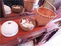 Two woven baskets: one with wooden handle and one