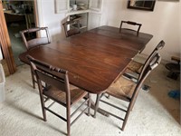 Mahogany table for leaves six rush bottom chairs