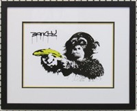 CHIMP WITH BANANA GUN BY GRAFFITI ARTSIT BANKSY