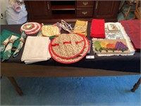 Group of placemats, dish towels, pot holders,