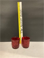 Two Ruby red candle holders